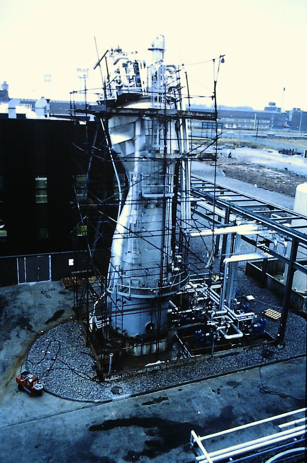 Tall metal vestle crushed in the middle