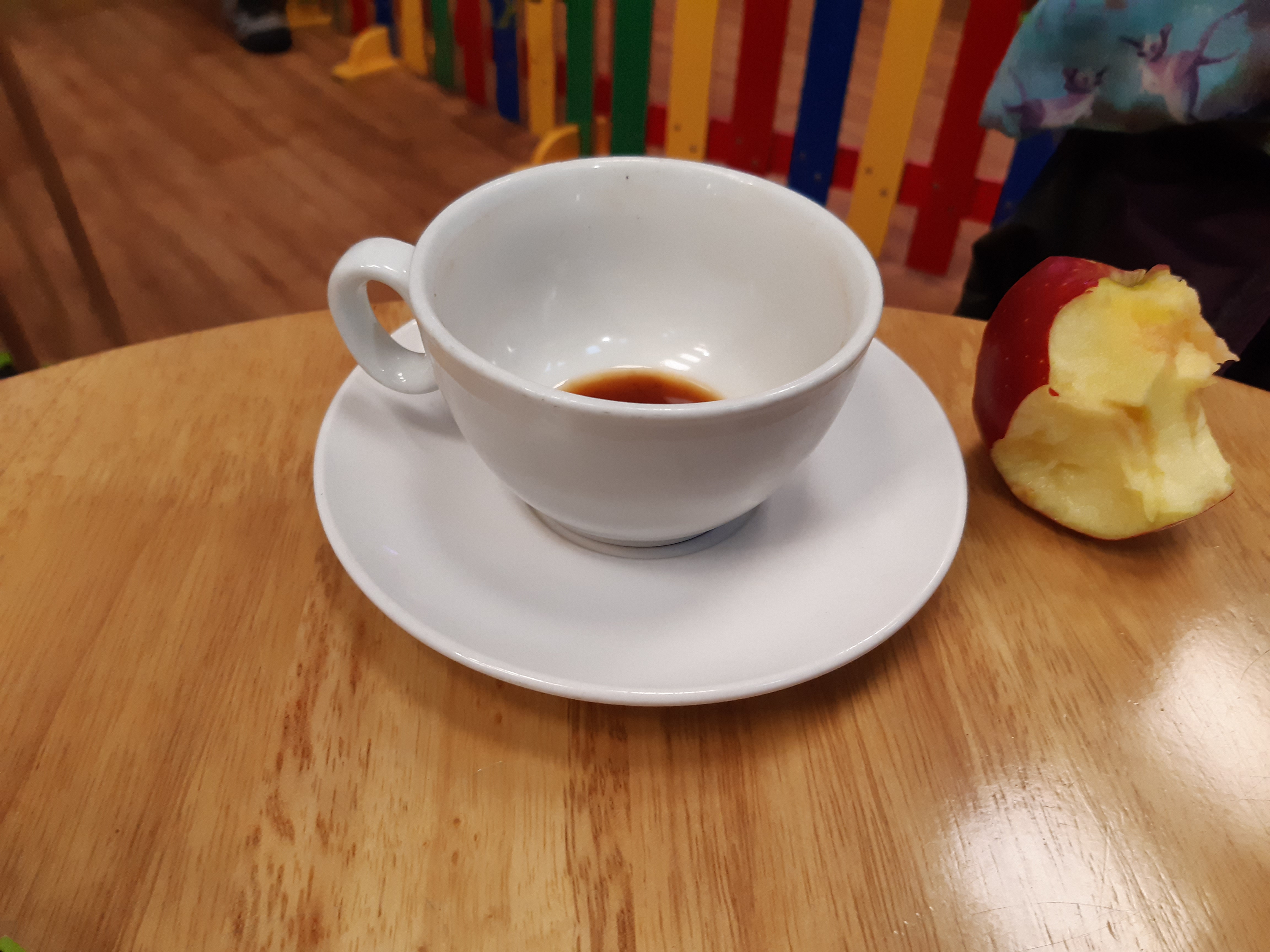 A nearly empty coffee cup.