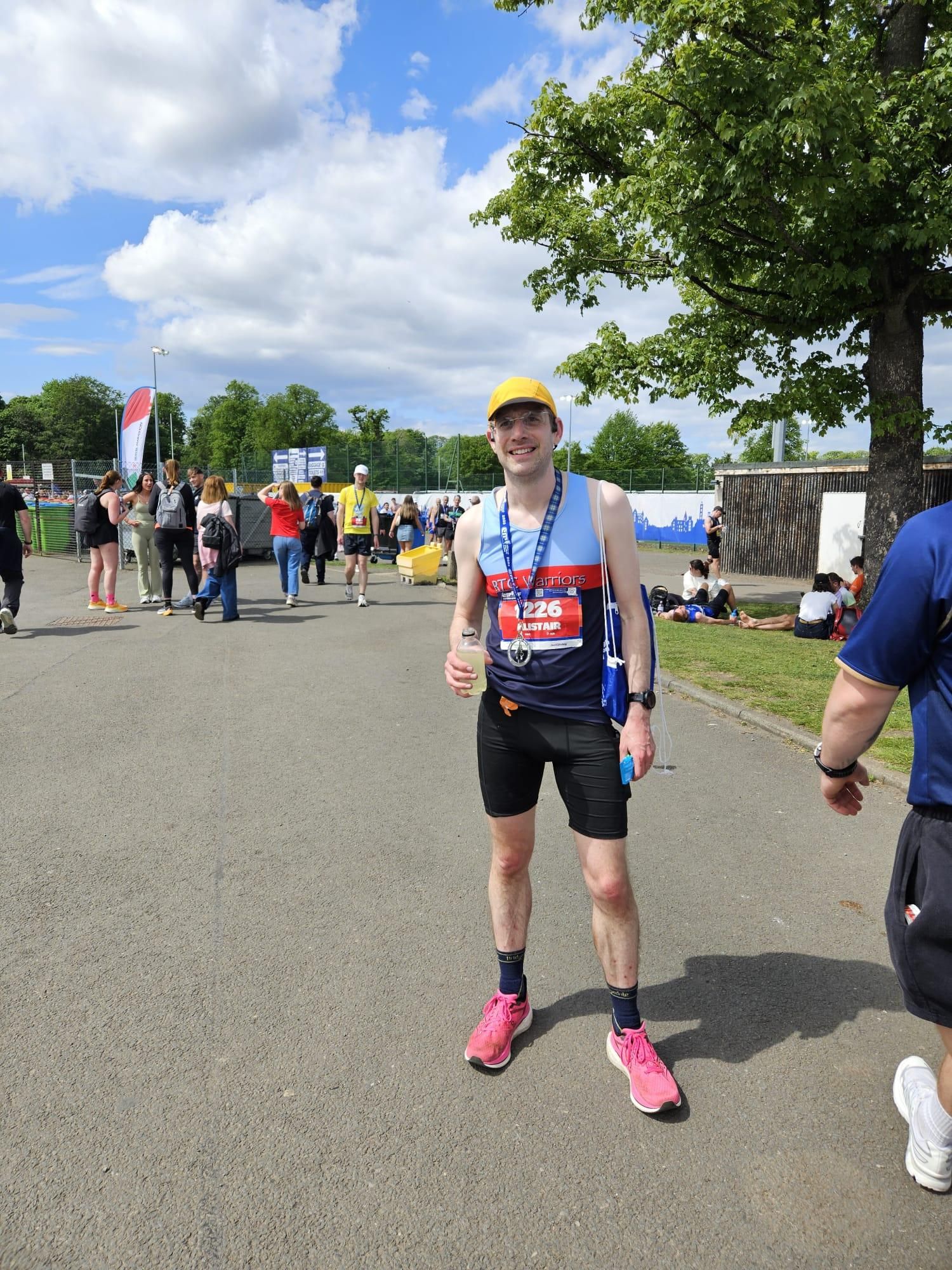 Finished Alistair standing with his medal