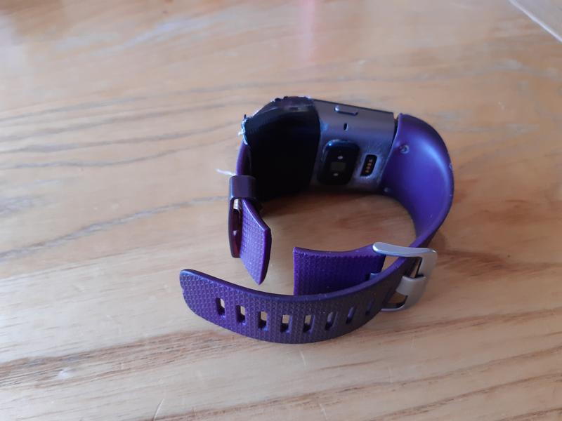 Fitbit surge with broken watch band and gaffer tape holding it together.