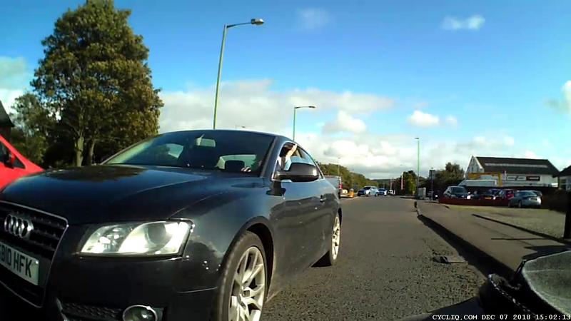 Black car overtaking very closely.